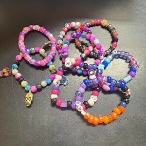 8 Pink beaded bracelets